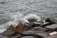 Waves on the lake crashing into the rocks