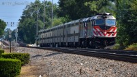 Metra 189 and a fellow F40PHM-2 shove east out of Brookfield Station