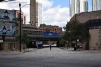 A Metra train crossing the single block stretch of Milwaukee Avenue under the lead to the Ogilvie Transportation Center