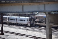 A South Shore Line train slows to a stop at Van Buren Street