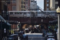 A Green Line train crosses through Tower 12 at the south end of the Loop, above Wabash and Van Buren