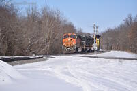 BNSF 7490 on the head end of a mixed freight with a High/Wide load behind the power